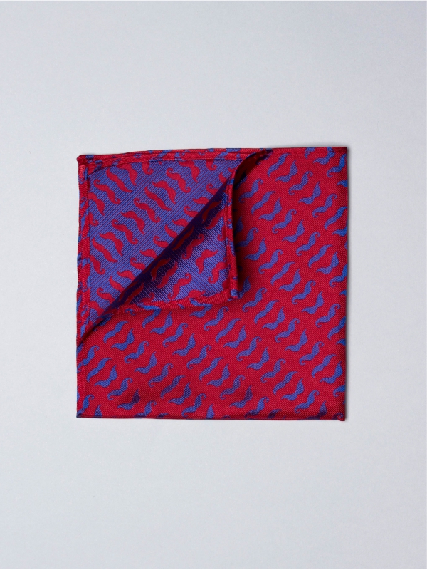 Red pocket square with blue moustache patterns
