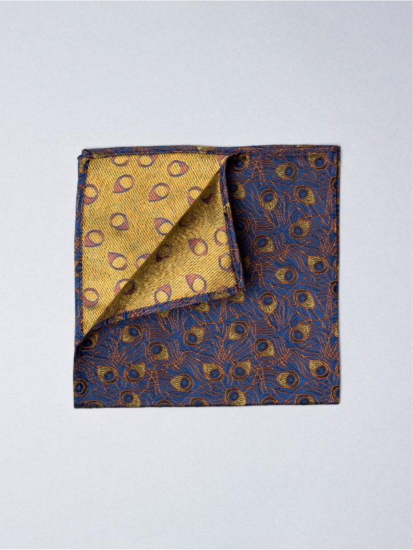 Blue pocket square with orange peacock feather patterns
