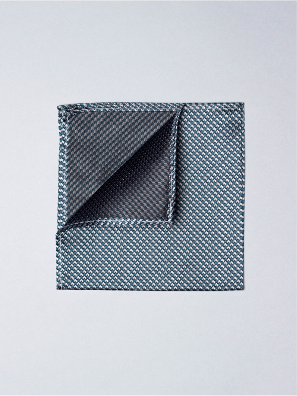 Blue pocket square with grey houndstooth patterns