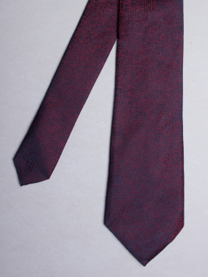 Blue tie with burgundy speckled effect