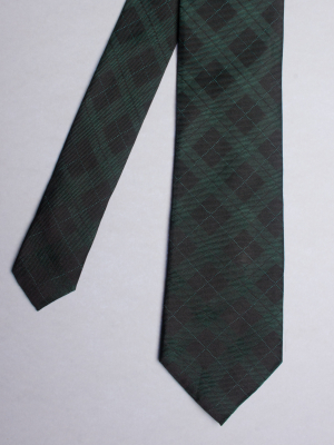 Green tie with checked pattern