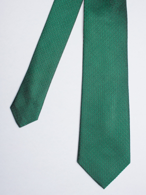 Green tie with triangle patterns