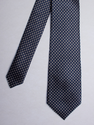 Tie with blue and white squares patterns