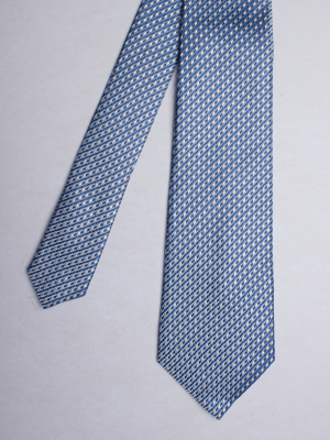 Blue tie with tricolor patterns