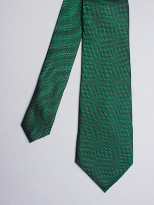 Green tie with weaving
