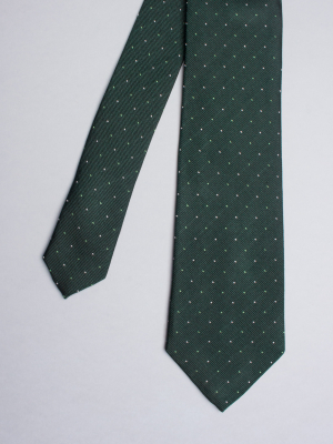 Green tie with white and green micro dots patterns