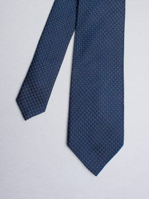 Blue tie with black flowers patterns