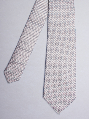 Light grey tie with ovals patterns