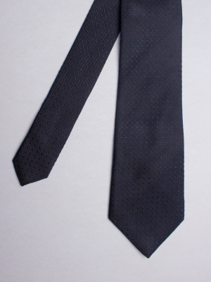Cravate bleu marine à motifs carrés