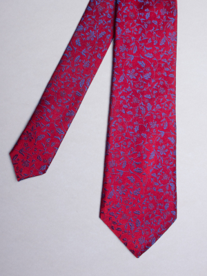 Cravate rouge à motifs fleurs bleues