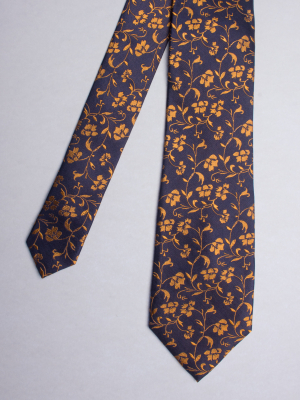 Cravate bleu marine à motifs fleurs dorées