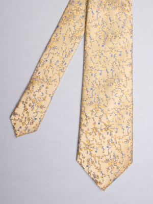 Yellow tie with flower patterns