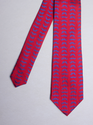 Red tie with blue moustache patterns
