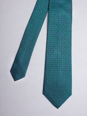 Blue tie with green propellers patterns