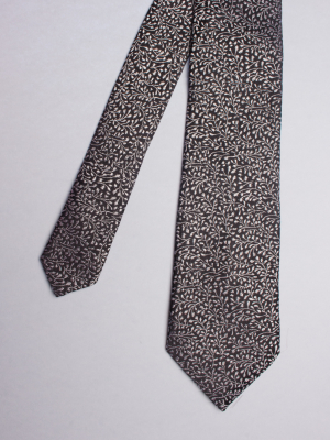 Cravate noire à motif floral argenté