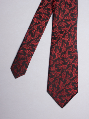 Cravate noire à motifs fleurs rouges