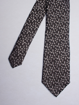 Cravate noire avec motifs fleurs blanches