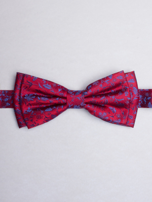 Red bow tie with blue flowers patterns