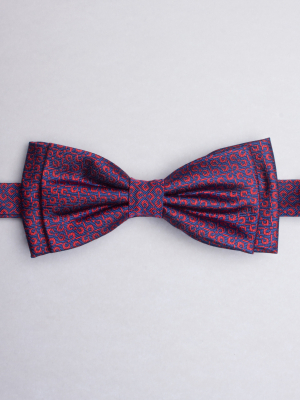 Blue bow tie with red propellers patterns