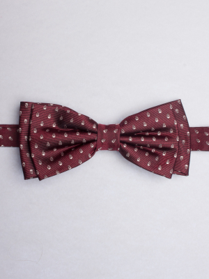 Wine-coloured bow tie with skulls patterns