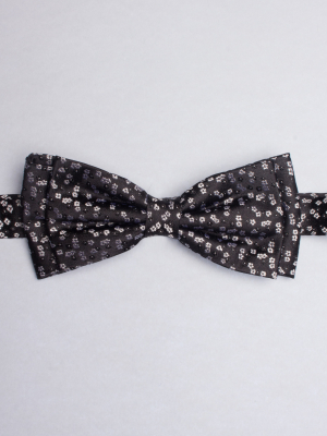 Black bow tie with white flowers patterns