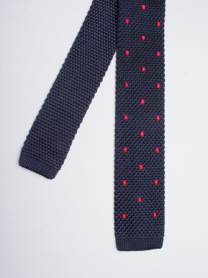 Navy blue knitted silk tie with red dots