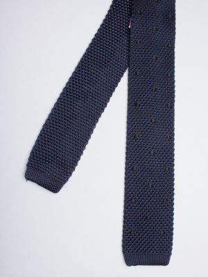 Navy blue knitted silk tie with black dots