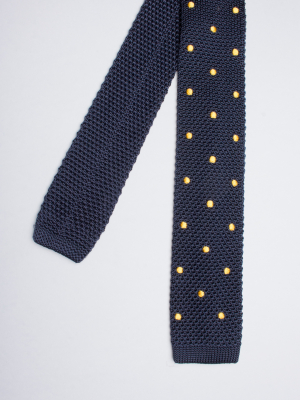 Navy blue knitted silk tie with yellow dots